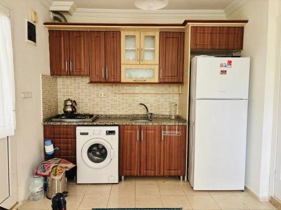 Erdgeschosswohnung (1+1) Mit Meerblick Im Stadtteil Bengiler, Seferihisar, Izmir Zu Verkaufen.