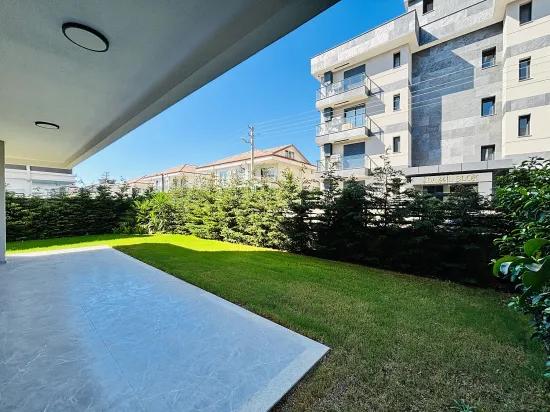 Seferihisar Im Necat Hepkon Nachbarschaft Im Wohnkomplex mit Pool freistehende Wohnung mit Garten zu verkaufen 2+1